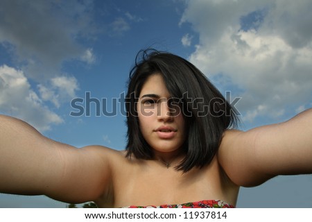 Gloomy image of woman with her arms extended towards the camera