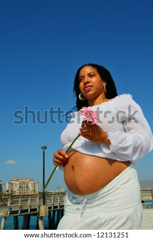 Pregnant woman with stomach exposed