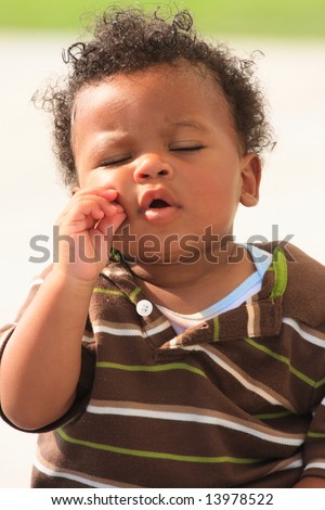 Cute Baby Pinching his Cheek