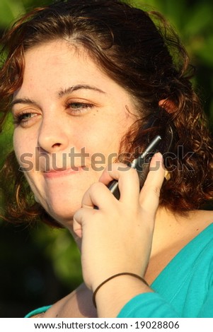 Woman with happy facial expression on the phone