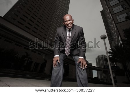 Unusual perspective of a businessman smiling at the camera
