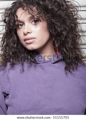 Head shot of a beautiful woman with wavy hair