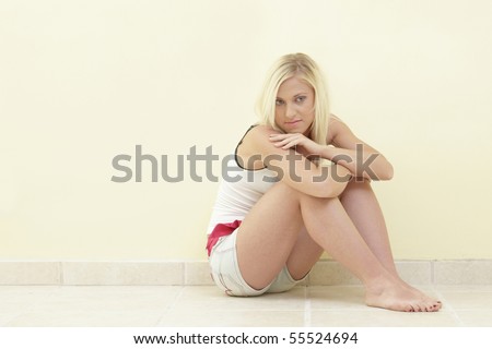 Woman sitting with knees bent