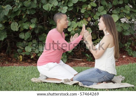 Two women playing games in the park