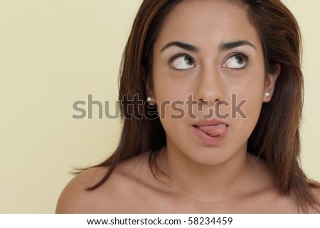 Young Woman Making A Funny Face And Sticking Out Her Tongue Stock Photo ...