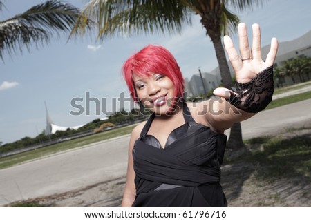 Woman showing her palm and smiling