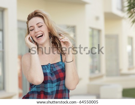 Woman laughing and talking on the phone