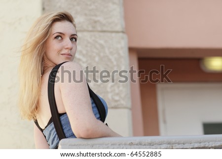 Young woman looking over her shoulder