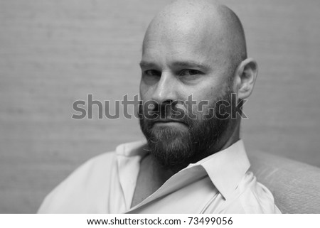 Black and white image of a handsome bald man