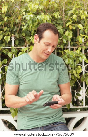 Man playing with his smartphone