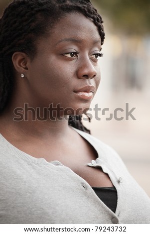 Young black woman looking sideways