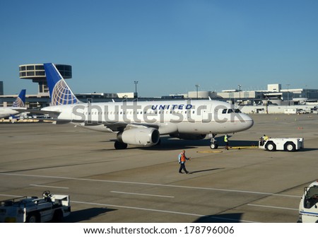CHICAGO - SEPTEMBER 22: United Airlines passenger jet arrives in its home base of Chicago on September 22, 2013. United uses Chicago as a major hub.
