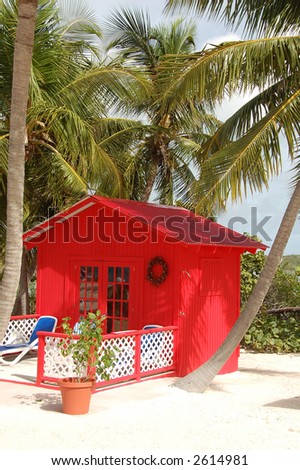 hidden red cabin on a tropical beach