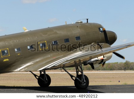 World War II era transport airplane taxiing on the ground