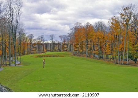 A challenging golf course hole on a stormy autumn day.