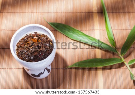 Japanese cup of tea on bamboo mat