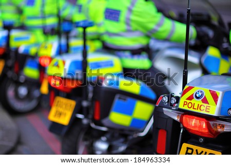 LONDON, UK - SEPTEMBER 7: Police motorcycles were waiting by the Tower bridge for permission to go as something was happening by Tower bridge on September 7, 2013
