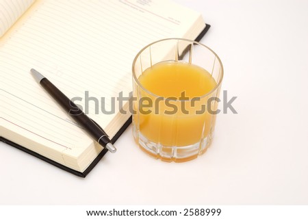 orange juice and a diary