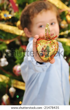 christmas time with a boy give a christmas gold heart