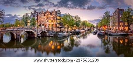 Similar – Image, Stock Photo Serene canal in old city district with aged buildings
