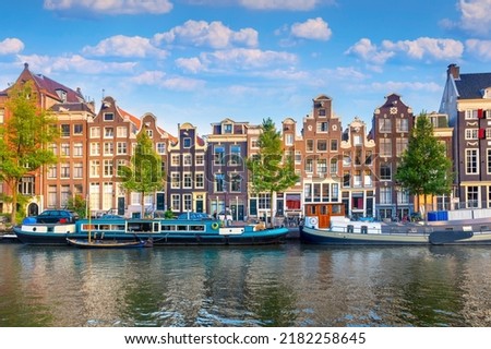 Similar – Image, Stock Photo Serene canal in old city district with aged buildings