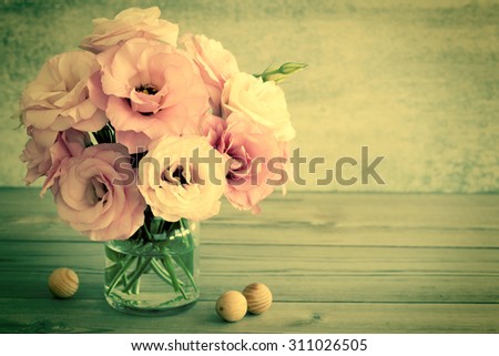 Gentle Flowers in a glass vase with copy space - vintage style still life, retro toned