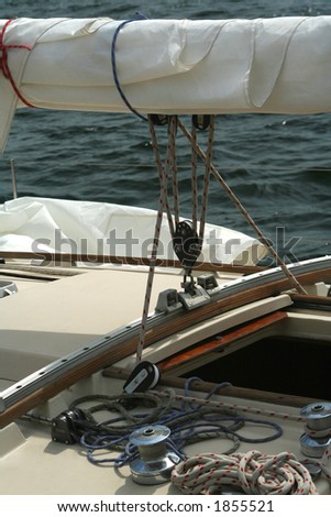 Detail of a sailing yacht. Sail, fastening and cords. Aboard a sailing yacht.
