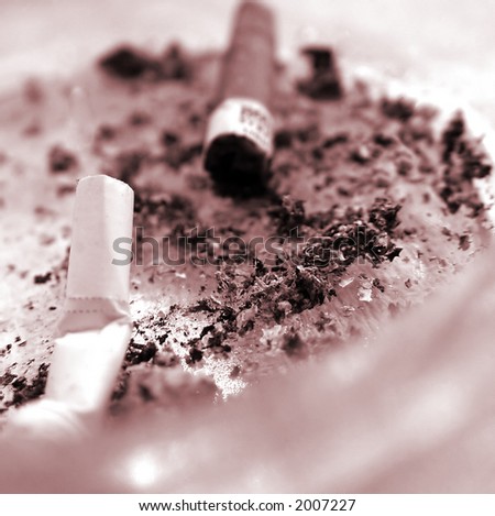 Stubs in an ashtray. The smoking it is harm for health. It is time to stop