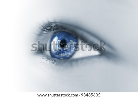 Young Eye with Sky and Clouds reflection / Macro