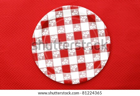 Red and White Checkered Plate isolated on red background
