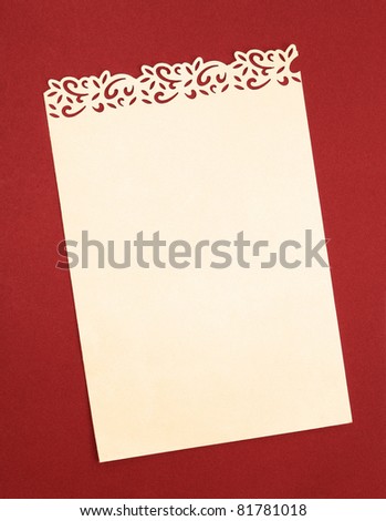 Vintage Cream Paper with Handmade Fancy Cutout Border isolated on Orange background