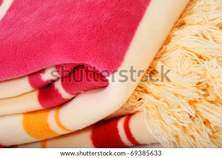 Two colorful blankets placed on each other