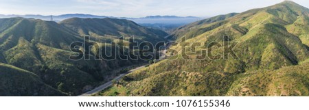 Similar – Image, Stock Photo Driving through Los Angeles in a convertible. LA, California.