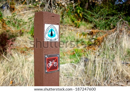 Wooden post marks the Pacific Crest trail in Angeles National Forest in southern California.