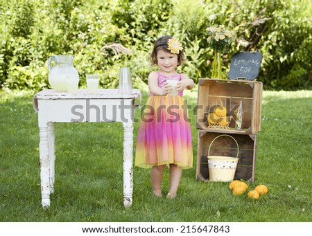 The Lemonade Stand.  Adorable little girl trying to sell lemonade at a roadside stand.