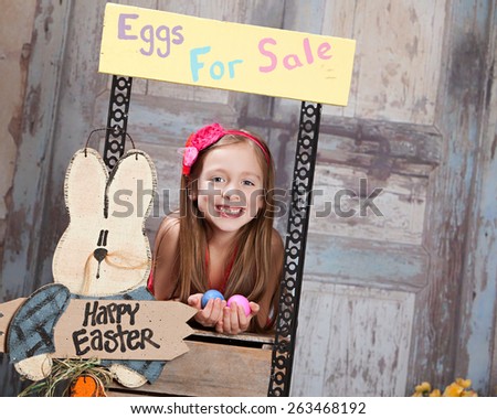 Eggs for Sale.  Attractive young girl selling Easter Eggs.  Room for your text.