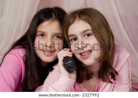 Two friends chatting on the phone.