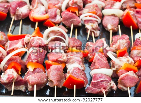 Raw meat on wooden sticks
