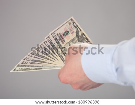 Businessman\'s hand reaching out euro banknotes