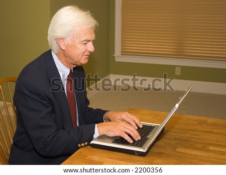 Senior Businessman on Laptop Computer