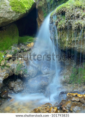 Small waterfall and stones. Natural composition