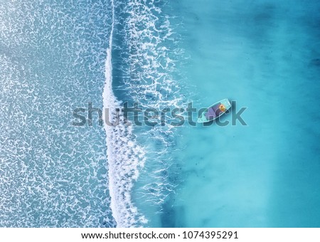 Photo of Wave and boat on the beach as a background. Beautiful natural background at the summer time from air