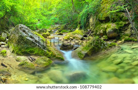 Transparent water in bright canyon. Natural composition
