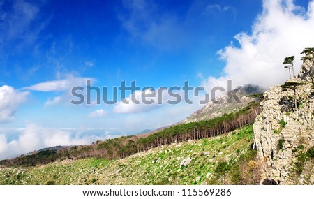 Mountain hill and sky with clouds. Natural composition
