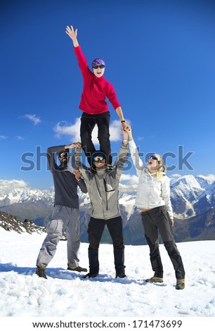 Team on the snowy mountain top. Sport and active life concept