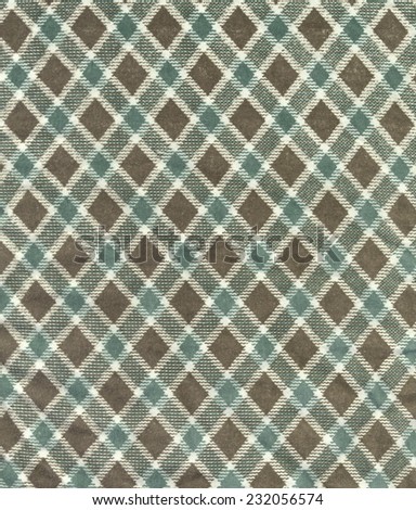 Retro geometric pattern texture. Fabric background. Vintage concept or conceptual old retro aged fabric. Shades of brown, green and blue