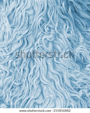 Fur texture. Abstract backgrounds. Boho, bohemian, retro, vintage style. Blue color carpet