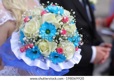 close up of elegance wedding bouquet in the hands of the bride