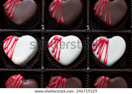 White and Dark Chocolate Red Velvet Cake Bites in a box for Valentine\'s Day