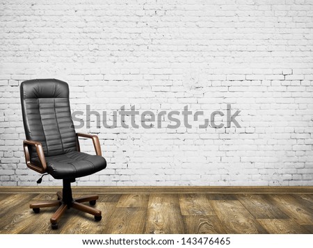 Black leather armchair in room. Business interior background